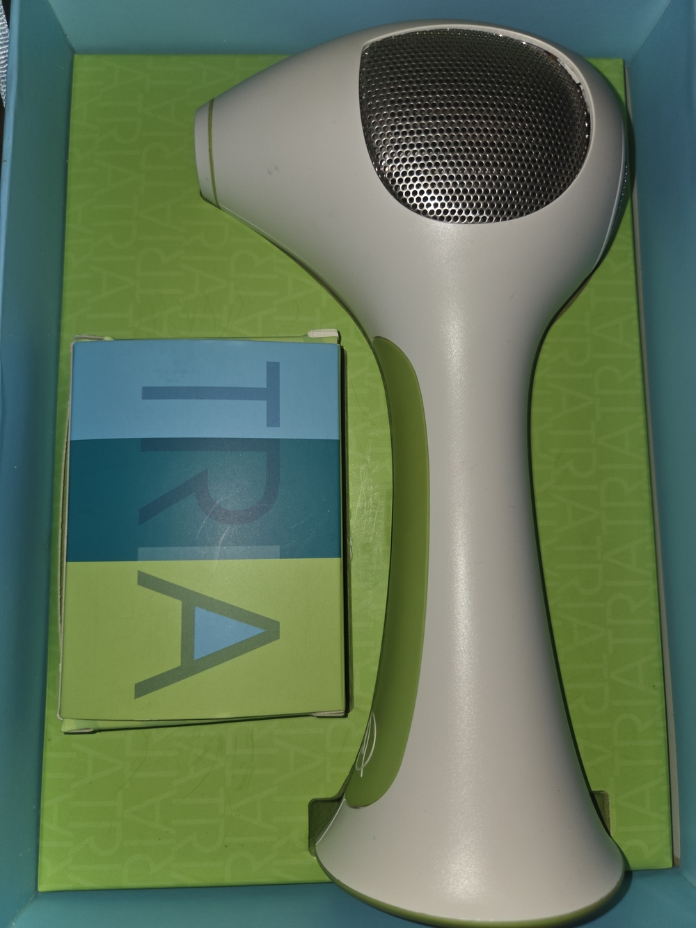 Tria Laser Hair Removal Device in White and Green